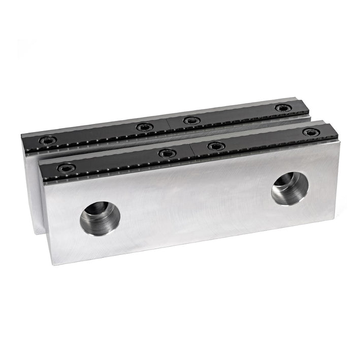 A set of serrated vice jaw components made of hardened steel, designed to be bolted into a standard machine vice.