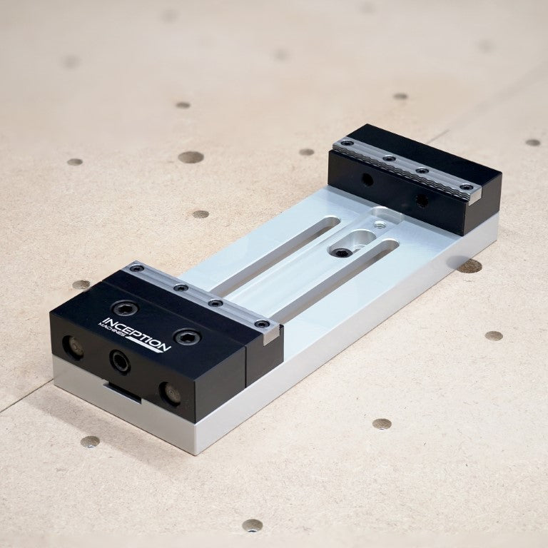 Low Profile Vice in the open position mounted to a cnc router wasteboard
