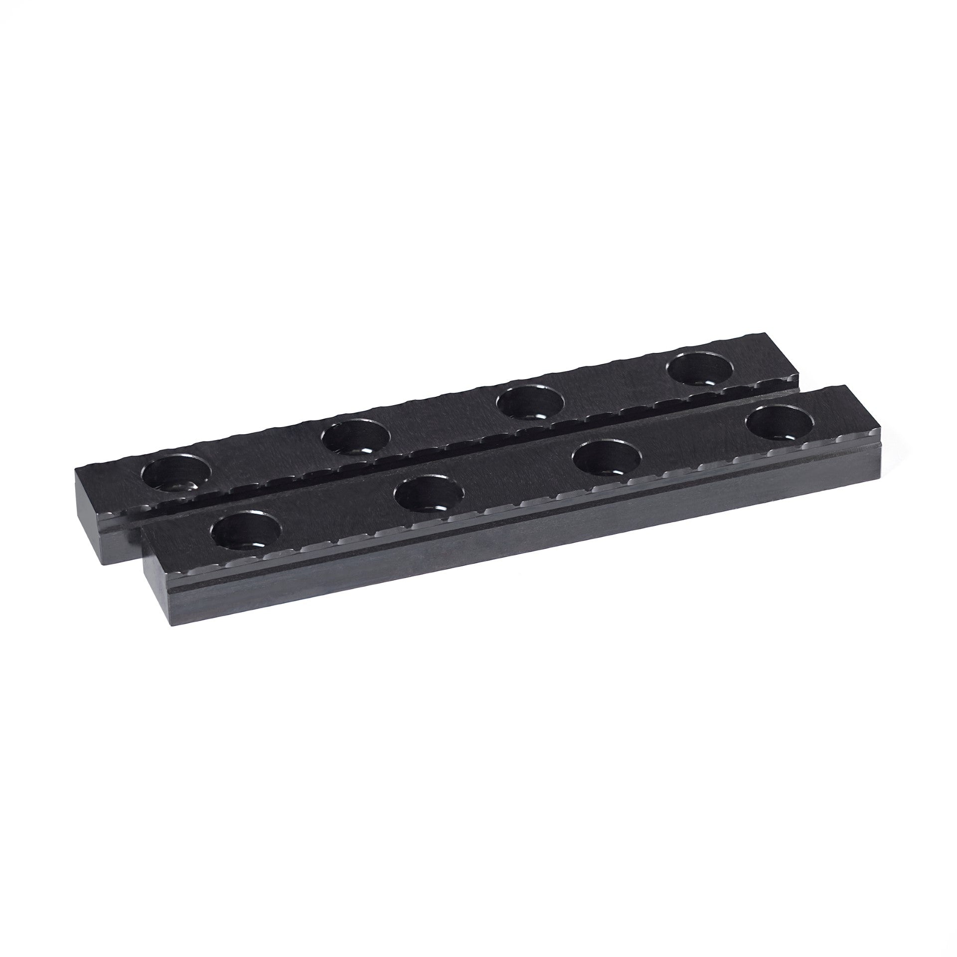 Two 100mm black steel serrated grippers designed for OP1 workholding in CNC machining