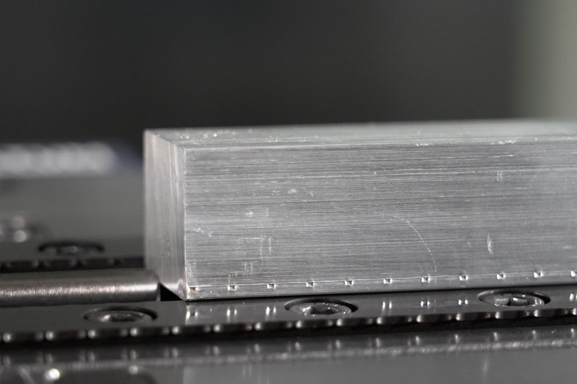 SerraGrip serrated gripper jaw indentation bite mark in aluminium
