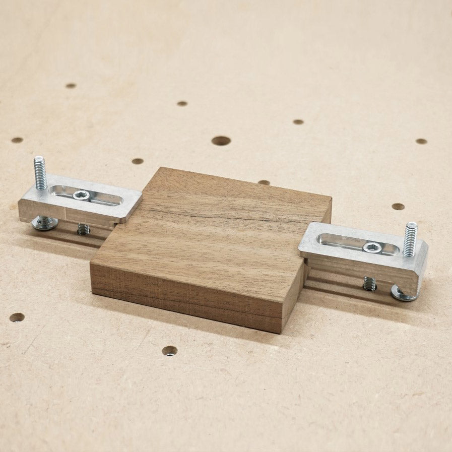 aluminium strap clamps holding a 20mm wooden block