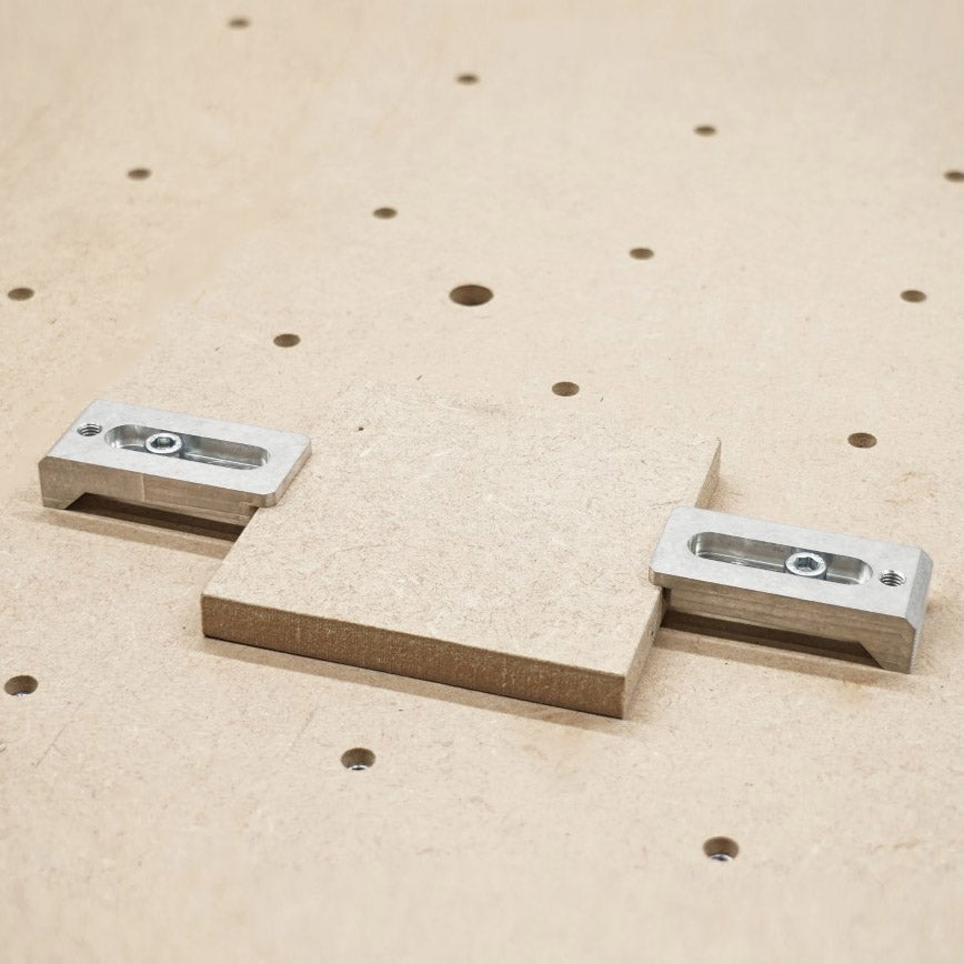 aluminium strap clamps holding a 12mm wooden block