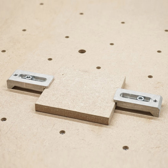 aluminium strap clamps holding a 12mm wooden block